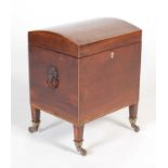 A George III mahogany and boxwood lined dome top cellarette,