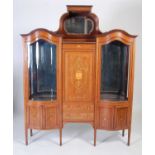 An Edwardian mahogany and marquetry inlaid serpentine display cabinet,