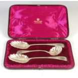 A 19th century silver gilt three-piece spoon set,