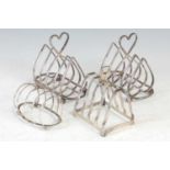 A collection of early 20th century electroplated and silver toast racks,