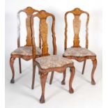 A set of three 19th century Dutch mahogany and marquetry inlaid side chairs,