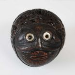 A late 18th century Spanish Colonial carved and pierced coconut bugbear money box,