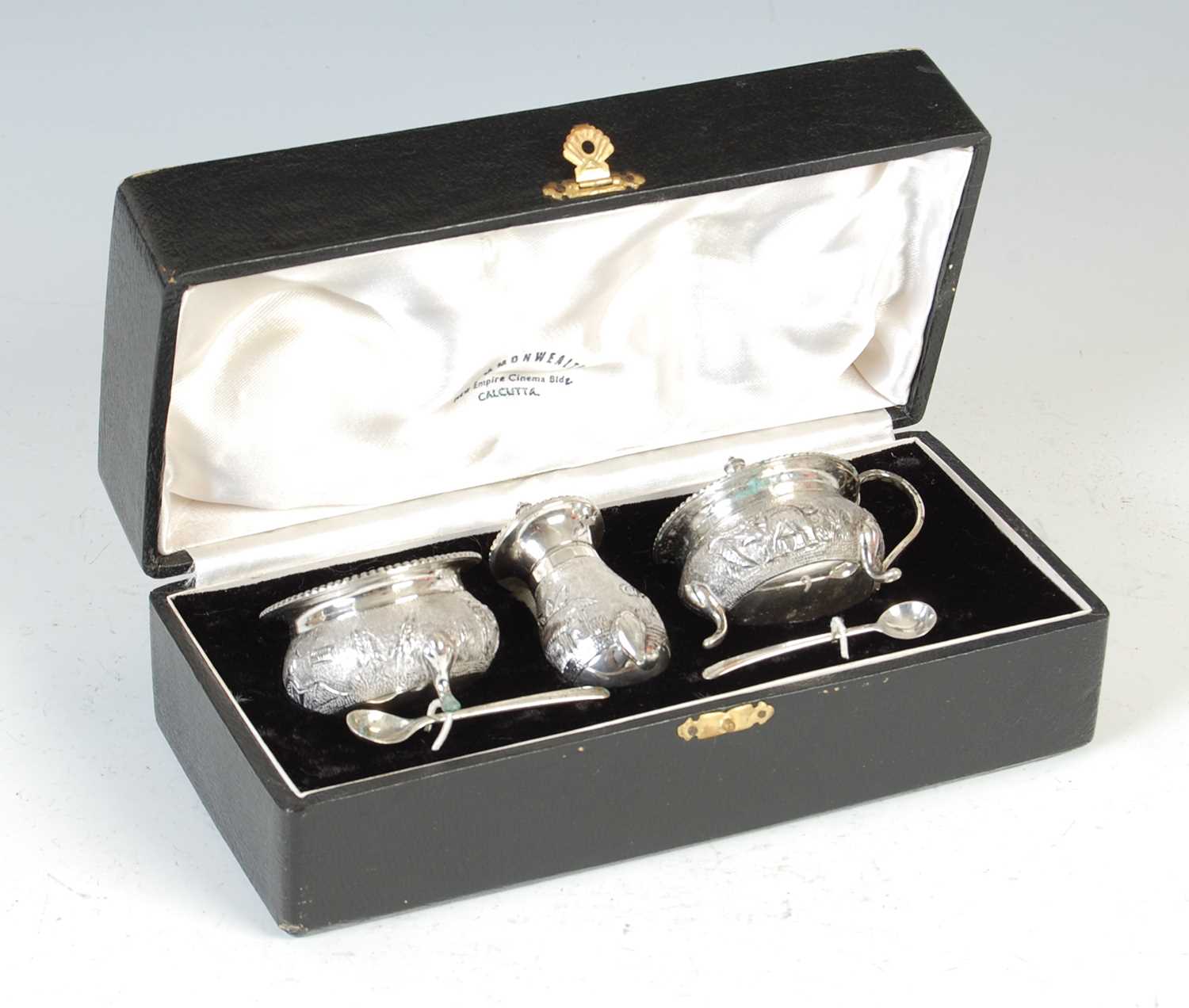 A late 19th / early 20th century Indian sterling silver three-piece cruet set,
