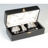 A late 19th / early 20th century Indian sterling silver three-piece cruet set,