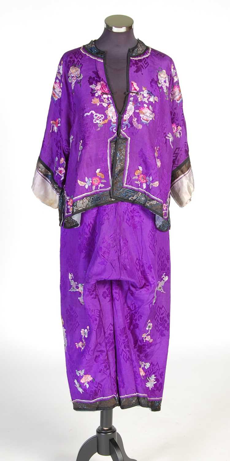 A Chinese purple ground embroidered ladies silk jacket and matching pantalons,