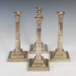 A set of four early 19th century silver Neoclassical style Corinthian column candlesticks,