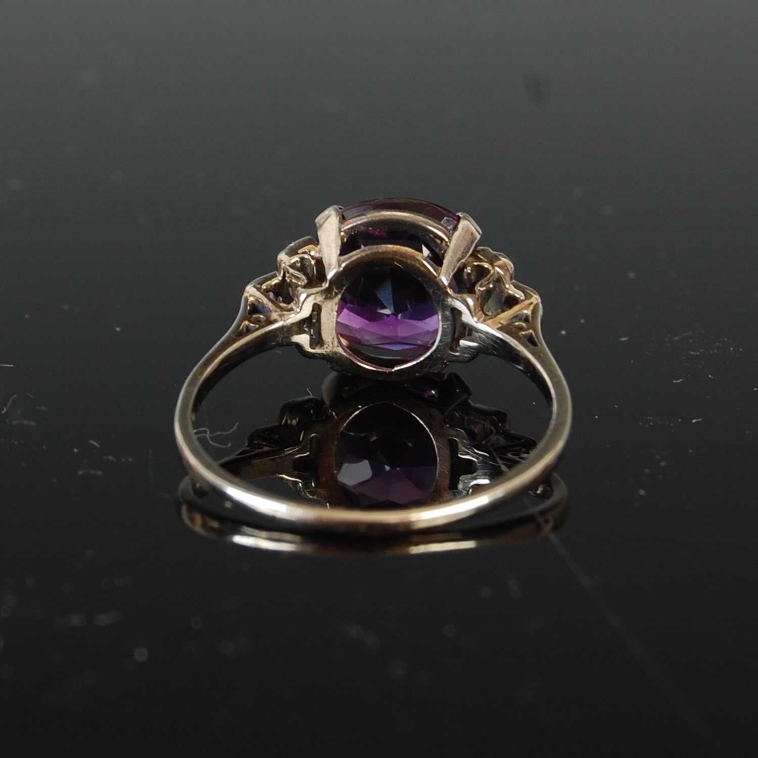 A mid 20th century Art Deco style white metal, amethyst and diamond set cocktail ring, - Image 6 of 6
