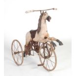 A Victorian style merry-go-round carved wooden horse converted to a tricycle,