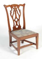 A late 19th / early 20th century mahogany gossip chair, attributed to Wheelers of Arncroach, with