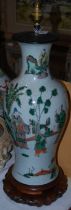 A Chinese porcelain crackle glazed famille vert vase, late Qing Dynasty, decorated with scholars and