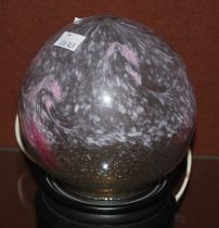 A Monart night-light mottled opaque white and pink glass with typical whorls, mounted on a stand,