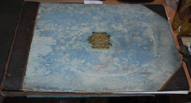 A part leather-bound photograph album with brass crest on the centre, late 19th century, the