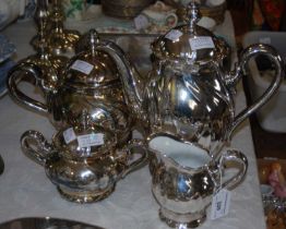 A four-piece silvered ceramic tea set by Hutschenreuther, Bavaria, Germany.