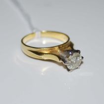 A white and yellow metal dimaond set solitaire ring stamped '18CT', ring size M, gross weight 5