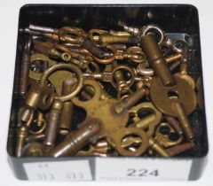 A collection of assorted pocket watch and carriage clock keys.