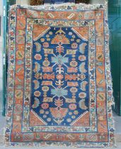 A Persian rug, late 19th / early 20th century, the rectangular blue ground decorated with stylised