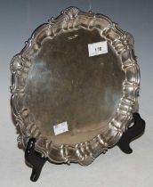 A Sheffield silver salver, makers mark of 'Walker & Hall', with shell and scalloped edge, engraved