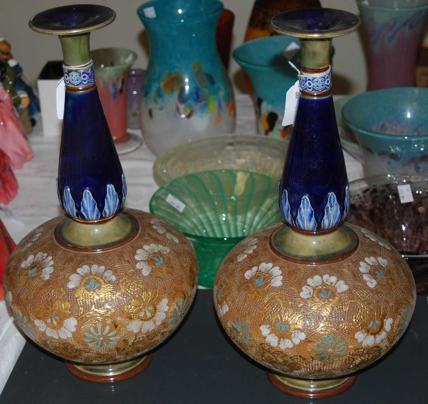 A pair of early 20th century Doulton Lambeth Art Nouveau bottle vases, the underside with Doulton