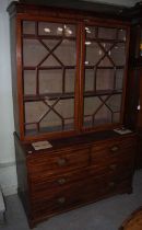 A late 19th/ early 20th century mahogany astragal glazed two-part bookcase, the upper section with