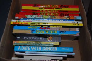 A box of assorted childrens books and annuals.