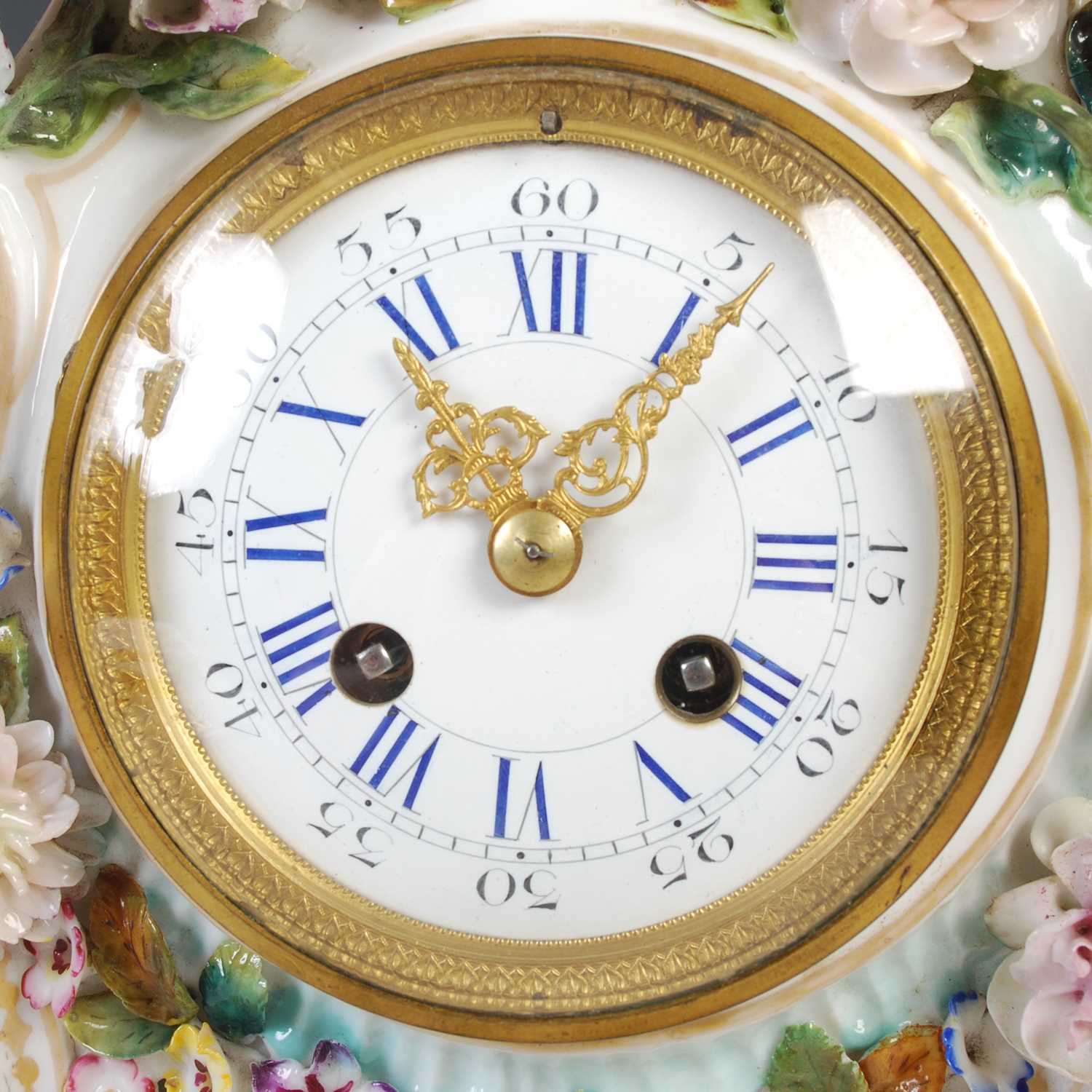 A late 19th / early 20th century Dresden porcelain mantle clock, the circular blue and white - Image 5 of 8