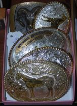 A solid bronze Steven L Knight belt buckle depicting a ram, together with four silver and brass-