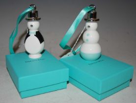 Two Tiffany & Co white metal mounted ceramic christmas tree decorations, each in the form of a