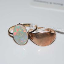 A 9ct gold signet ring and a yellow metal and opal set single stone ring stamped '9CT', gross weight