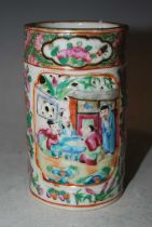 A Chinese porcelain famille rose Canton brush pot, Qing Dynasty, decorated with two pierced relief