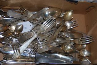 A box of EPNS and other mixed metal flatware.