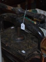 A Victorian cast iron book press.
