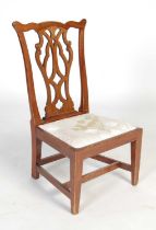 A late 19th / early 20th century mahogany gossip chair, attributed to Wheelers of Arncroach, with
