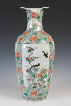 A Chinese porcelain famille vert vase, Qing Dynasty, decorated with a rectangular shaped panels