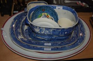 A collection of blue and white transfer printed items comprising ashets, planters, egg cups, mugs,