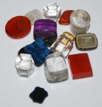 A collection of assorted glass and stone fob/ seal inserts.
