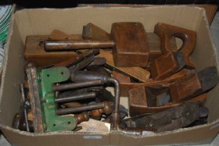 A box of assorted vintage tools to include a Marples vice, various planes, hand drill, etc.