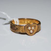 A late 19th century 15ct gold and split pearl ring centred with a heart, the band with open