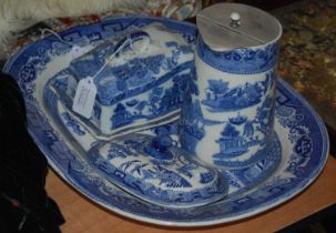 A collection of blue and white transfer printed willow pattern ceramics comprising butter dish, oval