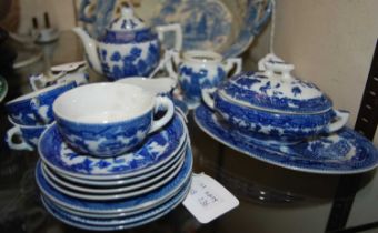 A 20th century blue printed willow pattern childs part tea set.