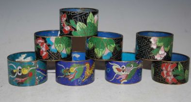 A collection of eight assorted polychrome cloisonne enamel napkin rings.