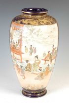 A Japanese Satsuma pottery blue ground vase, Meiji Period, decorated with two panels of Bijan,