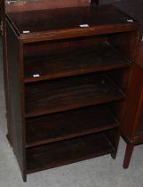 A stained oak open bookcase together with a stained oak hanging corner cupboard.