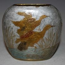 A gilt metal flattened oval-form vase, decorated with pairs of birds taking flight with red, black