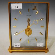 A Jaeger Lecoultre gilt metal rectangular-shaped mantle clock with floating mechanism and baton