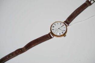 A vintage 18ct gold cased trench type wristwatch, the black, white and red enamel dial with Roman