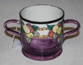 A Wemyss pottery purple ground hand-painted loving cup decorated with flowering branches, the rim