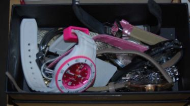A box of assorted ladies wristwatches to include an 'Ice Watch' in white and pink.
