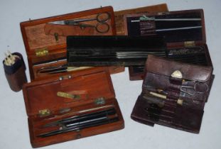 A collection of vintage surgical instruments in various fitted cases.