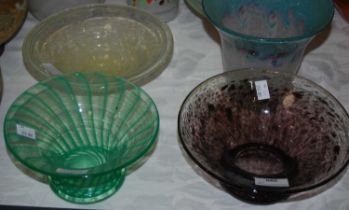 Three pieces of Ysart style glassware comprising a clear and mottled black footed bowl, a clear