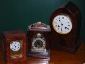 A late 19th century brass cased carriage clock with black and white circular Roman numeral dial in